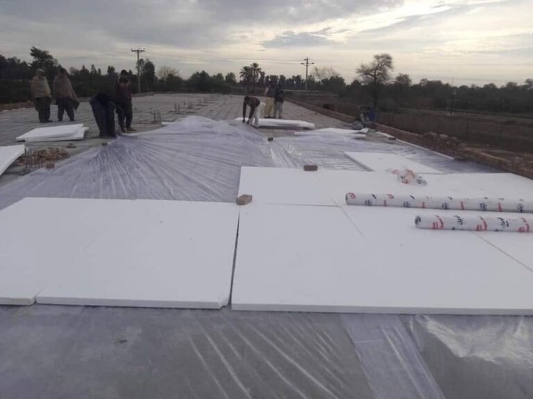 White EPS insulation sheets laid on a roof in Lahore - Insulation System
