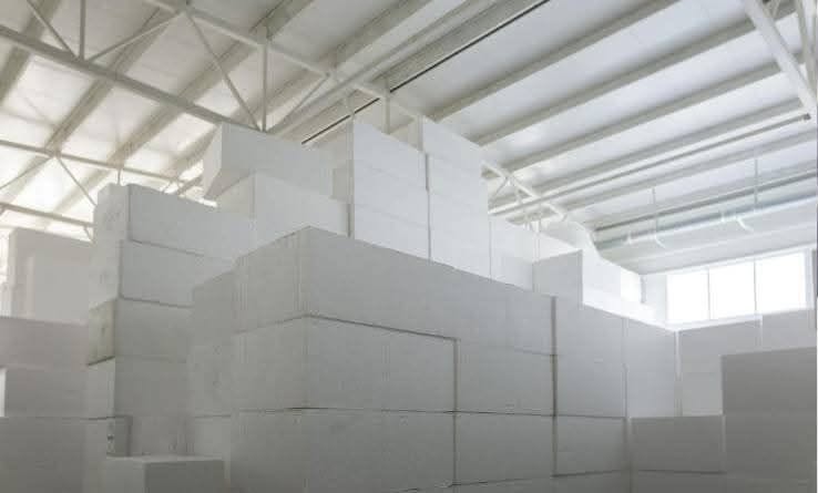 White EPS thermocol sheets stacked in warehouse at Insulation System Lahore