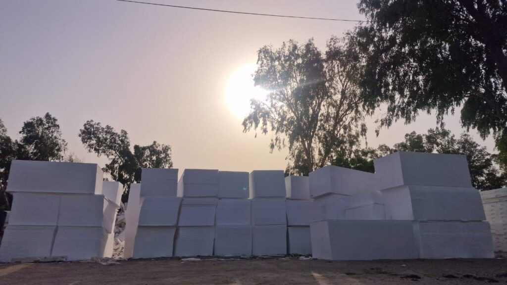 Stack of white EPS thermocol blocks at sunset in Insulation System stock yard