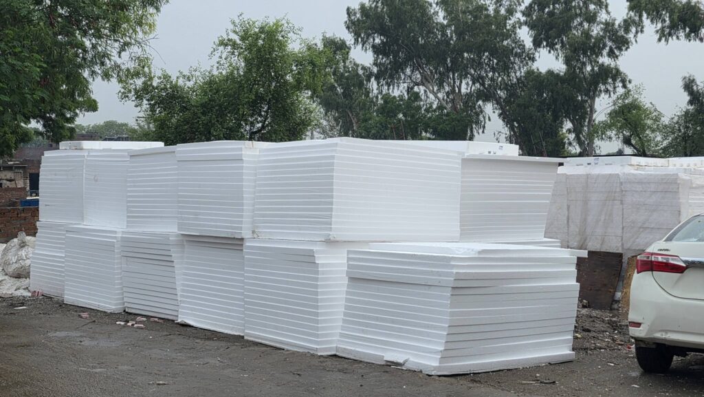 Stacks of white EPS thermocol sheets at the stock yard in Lahore - Insulation System