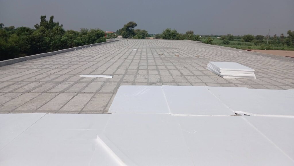 EPS thermocol sheets laid on a concrete roof for heat proofing in Lahore - Insulation System