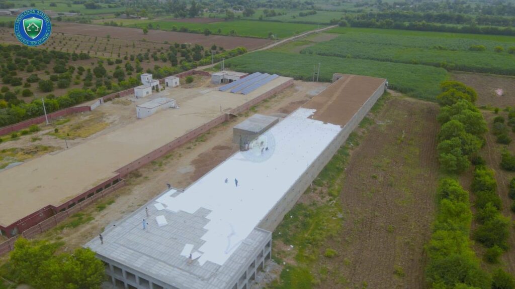 Poultry shed roof covered with white EPS insulation sheets in farmland area
