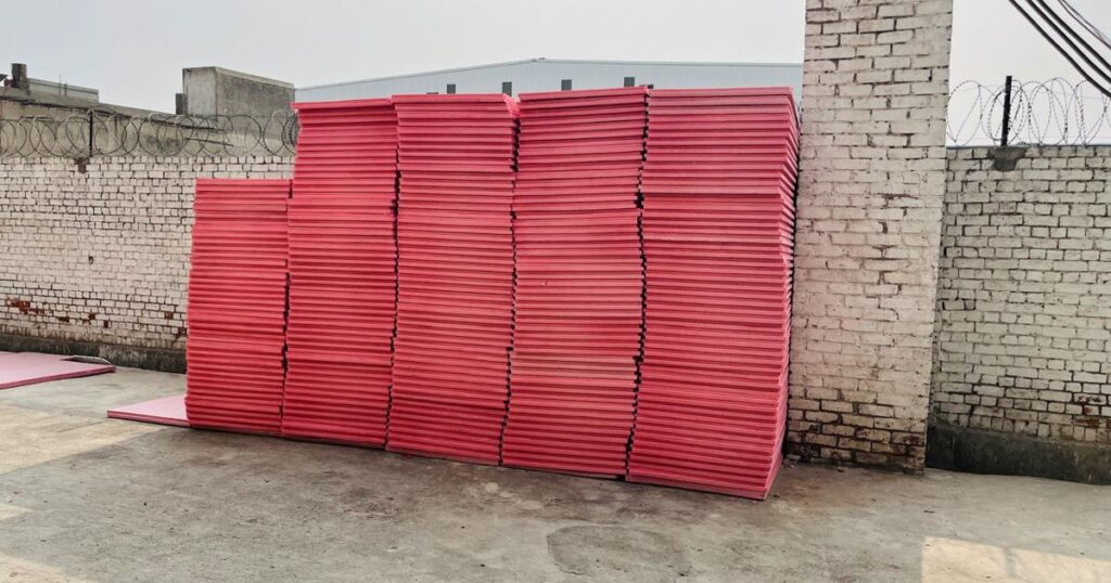 Stacks of pink Jumbolon XPS sheets in different thicknesses at the Insulation System factory in Lahore