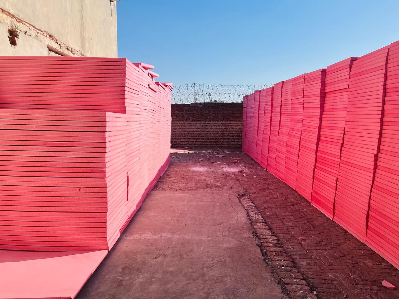 Pink Jumbolon XPS boards stacked in the Insulation System factory in Lahore