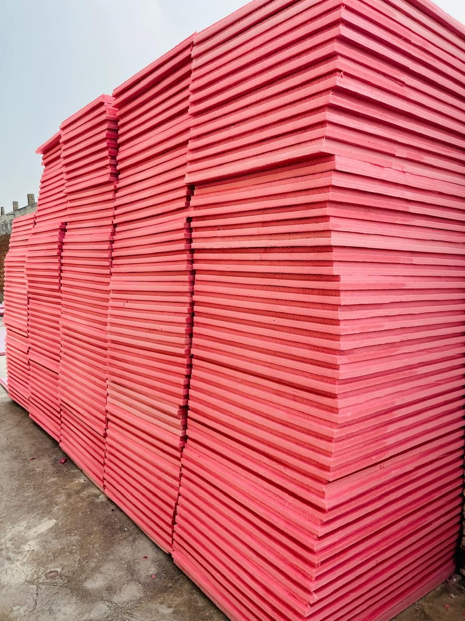 Stack of pink XPS insulation boards ready for dispatch from Insulation System, Lahore